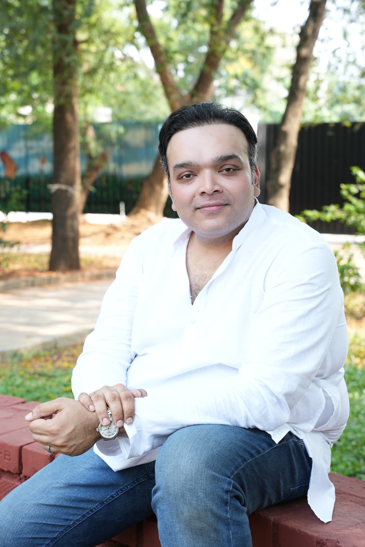 Cherag Shah seated outdoors